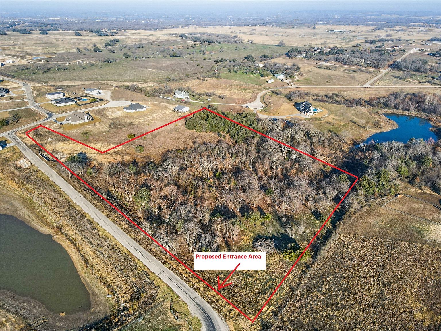Aerial view of the 11.88-acre Pioneer Crossing tract with property boundary and proposed entrance marked